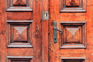 Vintage home worn entrance door design with old metallic handle