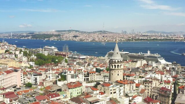 Aerial drone view of Golden Horn bay in Istanbul with Galata tower and cruise ships during summer sunny day