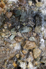mountain river flows fast over rocks close-up