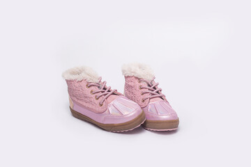 Fashionable children's boots for a girl on a white background.