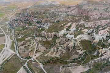 Panorama of Cappadocia at sunrise, seen from another hot air balloon.