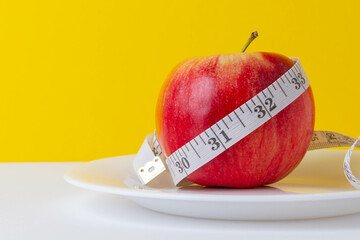Apple as a means for weight loss. Obesity problem. Fruit diet.