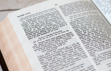 Open Holy Bible Book with verses about apostle Peter's denial of Jesus Christ. A closeup. Christian...