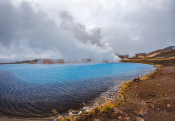 Blue lake panorama near geothermal power plants