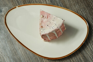 piece of birthday cake on a plate, top view