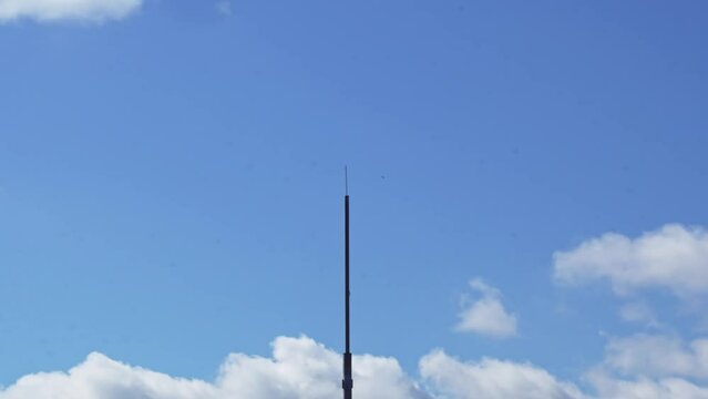 Time-lapse. cellular tower. sky with moving clouds. footage beautiful sky.
