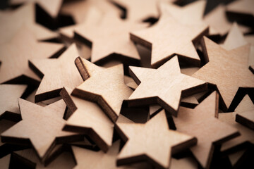 Group of small wooden stars, macro shot. Christmas background.