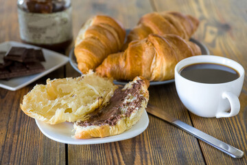 croissants with chocolate and a cup of coffee