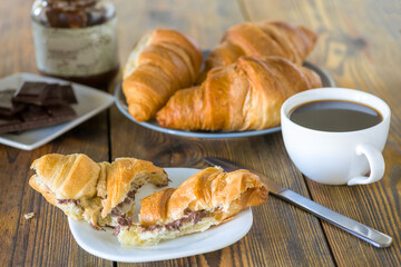 croissants with chocolate and a cup of coffee