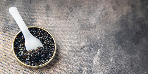 caviar black sturgeon fish beluga, stellate sturgeon fresh healthy meal food snack on the table copy space food background 