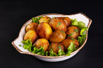 delicious baked potatoes on a dark background
