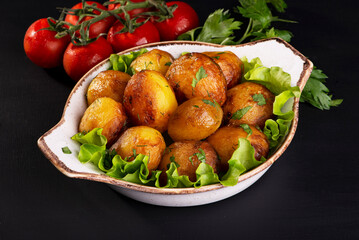 delicious baked potatoes on a dark background