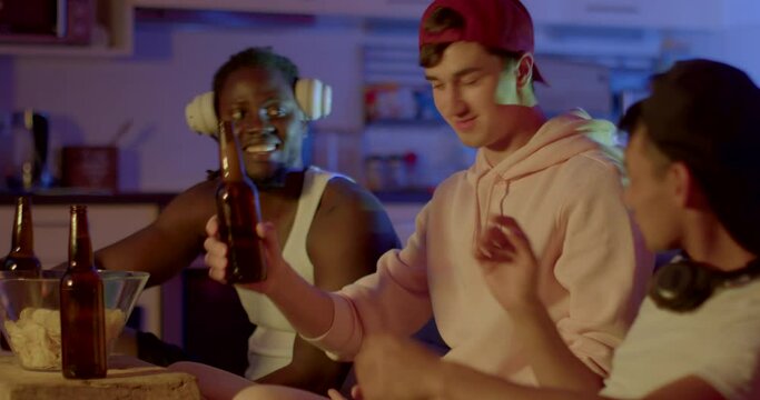 The joy of meeting old friends in the evening in the hostel. They say hello, make a welcome sign, take bottles with a drink, check their faces, start the party, free time.