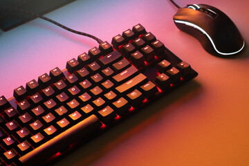 Red gaming keyboard. Keyboard with mouse, neon light. Mechanical keyboard with Red light. gaming concept. hacker concept. - obrazy, fototapety, plakaty