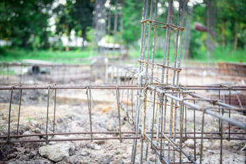 Close-up fabricating steel reinforcement bar at the construction site for building the house