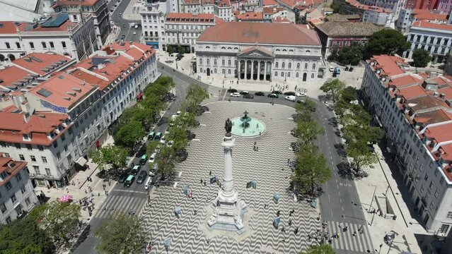 A drone camera flies around Dom Pedro IV Square in Lisbon, Portugal	