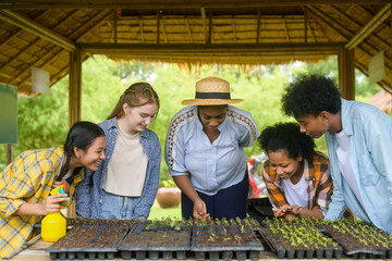 Group of mixed race students and teacher learning agriculture  technology in smart farming , education ecology agricultural concepts .