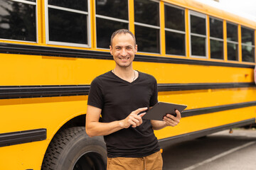 male teacher near school bus