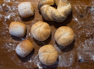 Various buns on a wooden table