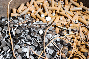 Metal waste in production. background. Waste metal on a stamping press. Recycling of metal waste at an industrial enterprise.