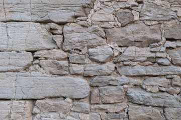 Massive stone wall background. Old castle rock wall.