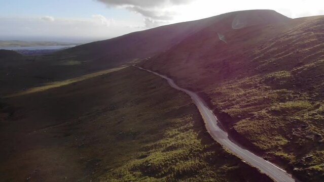 areal drone footage of road in mountains Ireland. Dingle, Kerry