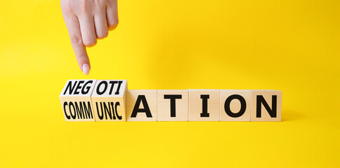 Negotiation vs Communication symbol. Businessman hand turns a cube and changes words Negotiation to Communication. Beautiful yellow background. Business concept. Copy space