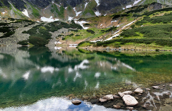 Mountain reflections in an alpine lake, Zakopane, South Poland, Poland
