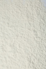 Pile of organic flour as background, top view