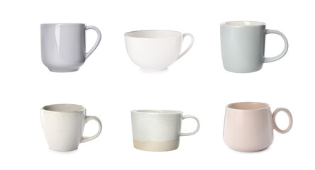 Set with different beautiful cups on white background