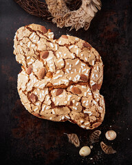 Colomba Pasquale, Italian Easter Dove Sweet Bread Colomba di Pasqua on dark surface. Selective focus, space for text. Traditional dessert in Italy.