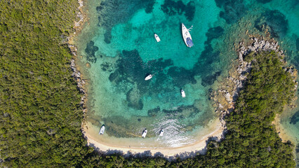 Awesome view of Bela Vraka Beach and Park in Sivota, Greece. Drone flying over the beach. Summer and travel vacation concept. View from above, stunning aerial view