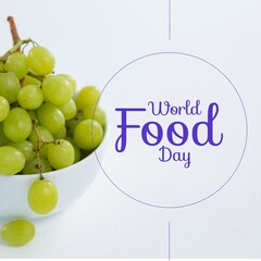 Image of world food day over grapes in bowl on white background