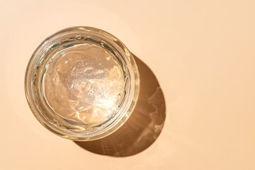 Transparent cosmetic liquid in glass jar. Tonic or toner gel aloe serum. Mockup