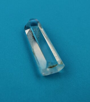 Beautiful Quartz Crystal Point on a Bright Blue Background