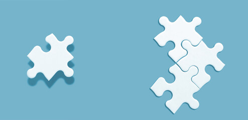 White jigsaw puzzle on green background, Find the right joined team and fit correctly concept, space for writing copy