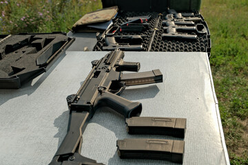 military weapon lies on the table. pistol . weapons at the shooting range
