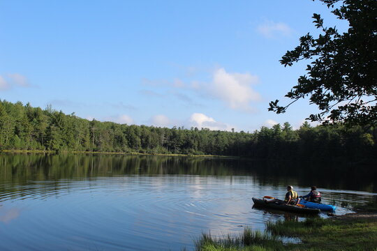 Two Kayakers on a Pond