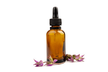 A bottle of essential oil with fresh blooming clary sage twigs on white background.