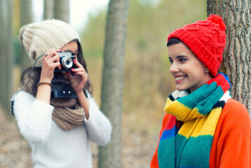 Two girls having fun in the autumn nature