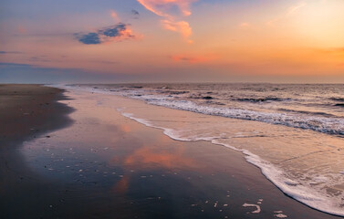 colorful sunset on the beach, mud flat
