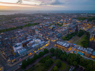New Town and Scott Monument on Princes Street aerial view at sunset in Edinburgh, Scotland, UK. New town Edinburgh is a UNESCO World Heritage Site since 1995. 