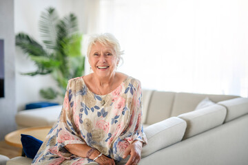 Active beautiful senior woman in the living room.