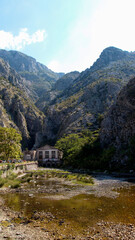 Fototapeta na wymiar Beautiful view of mountain landscape with river, trees, mountains