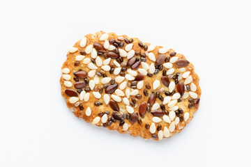 Tasty crackers with seeds on the white background.