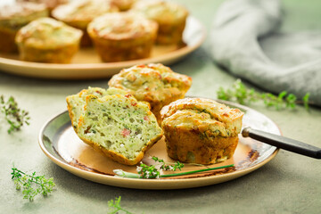 Savory zucchini muffins with herbs, feta cheese and bacon