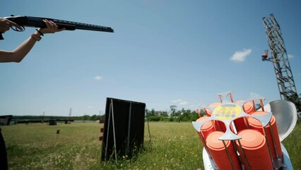 Sportsman shoots from a double-barreled shotgun, A sports field for a shooting test is shooting at flying skeet