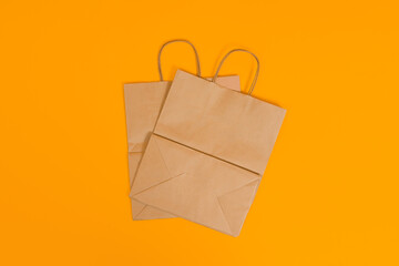 folded paper bag on color background