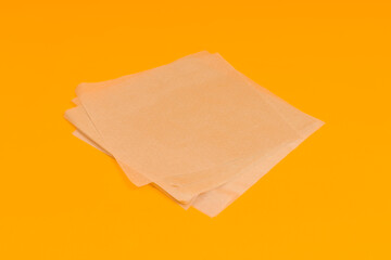 wrapping paper, sheets of parchment on a colored background