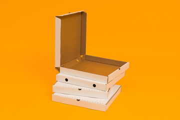 pizza box open on yellow background